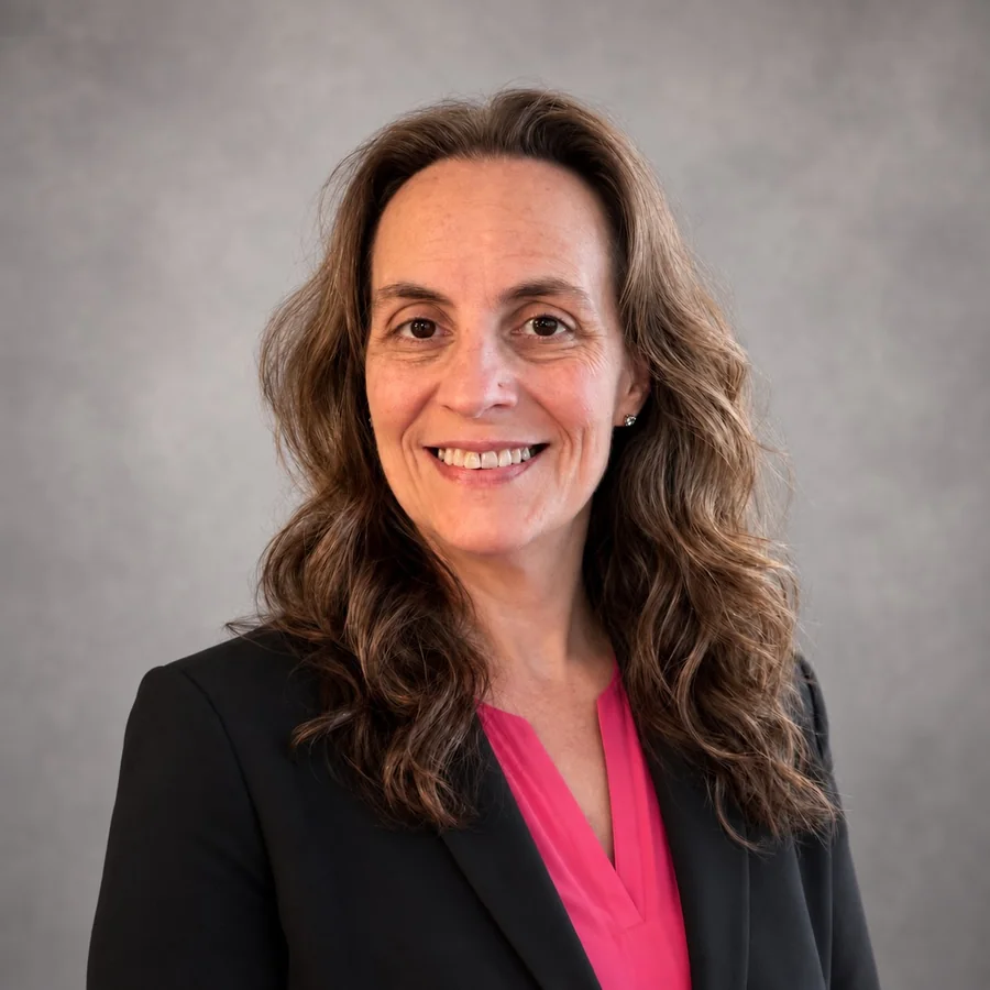 Portrait of Nicole Palazzo, Princess Cruise Vacation Planner, wearing a black blazer and pink blouse.